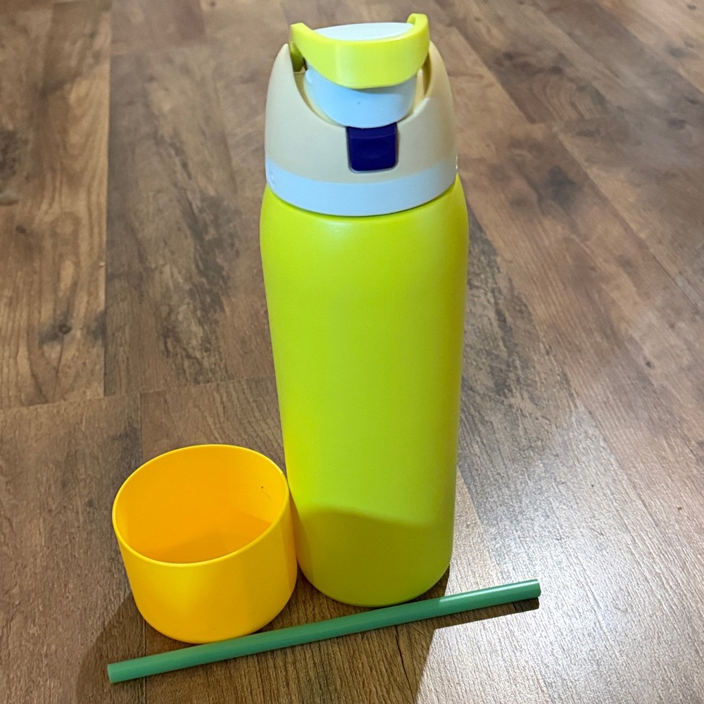 Owala 40 oz Yellow Water Bottle with Straw and matching rubber foot.